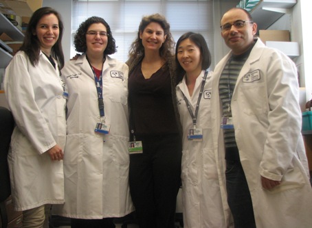 Rachael A. Clark, MD, Phd (Center) and lab team